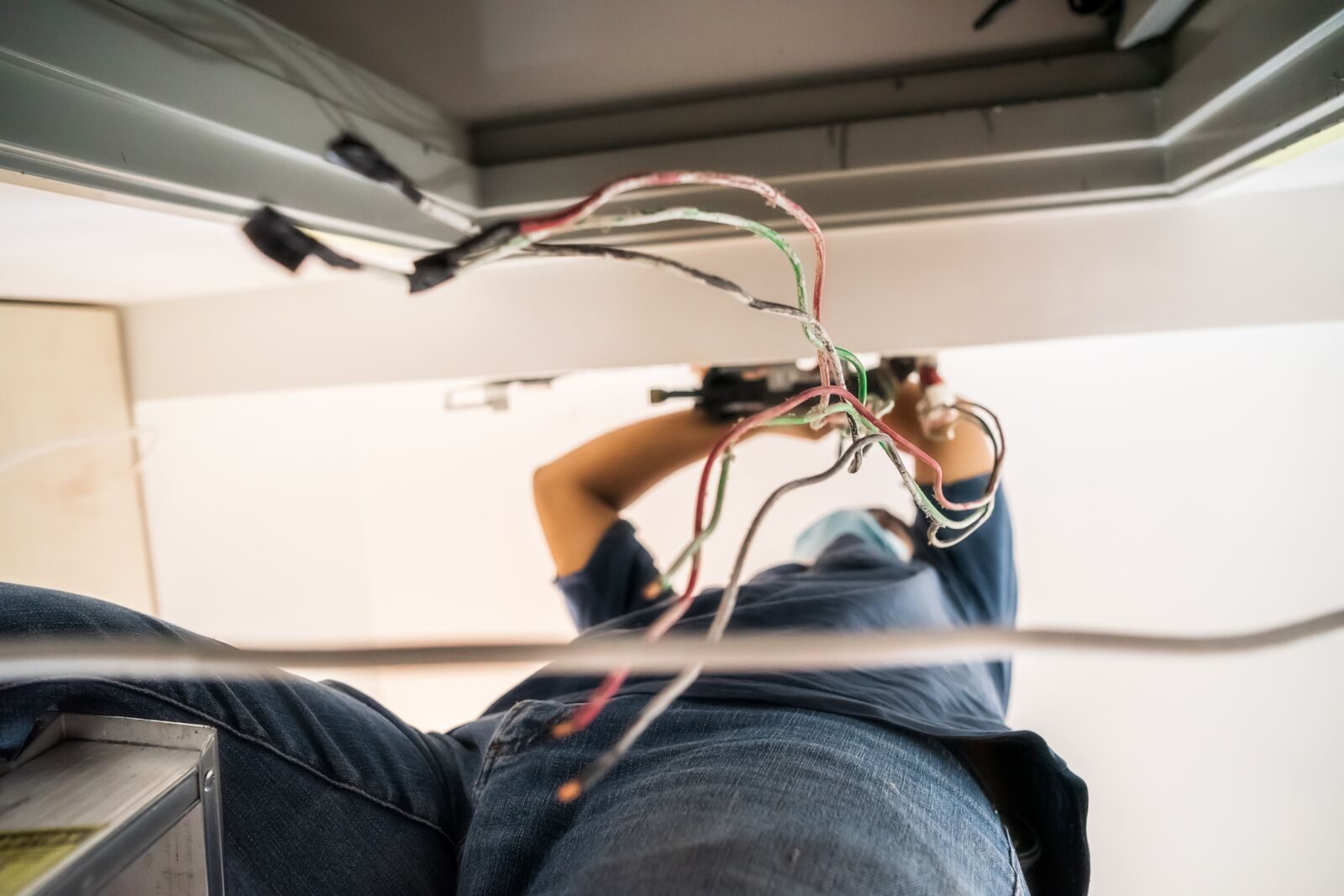 Electrician completing neat circuit wiring at a home in Edenvale