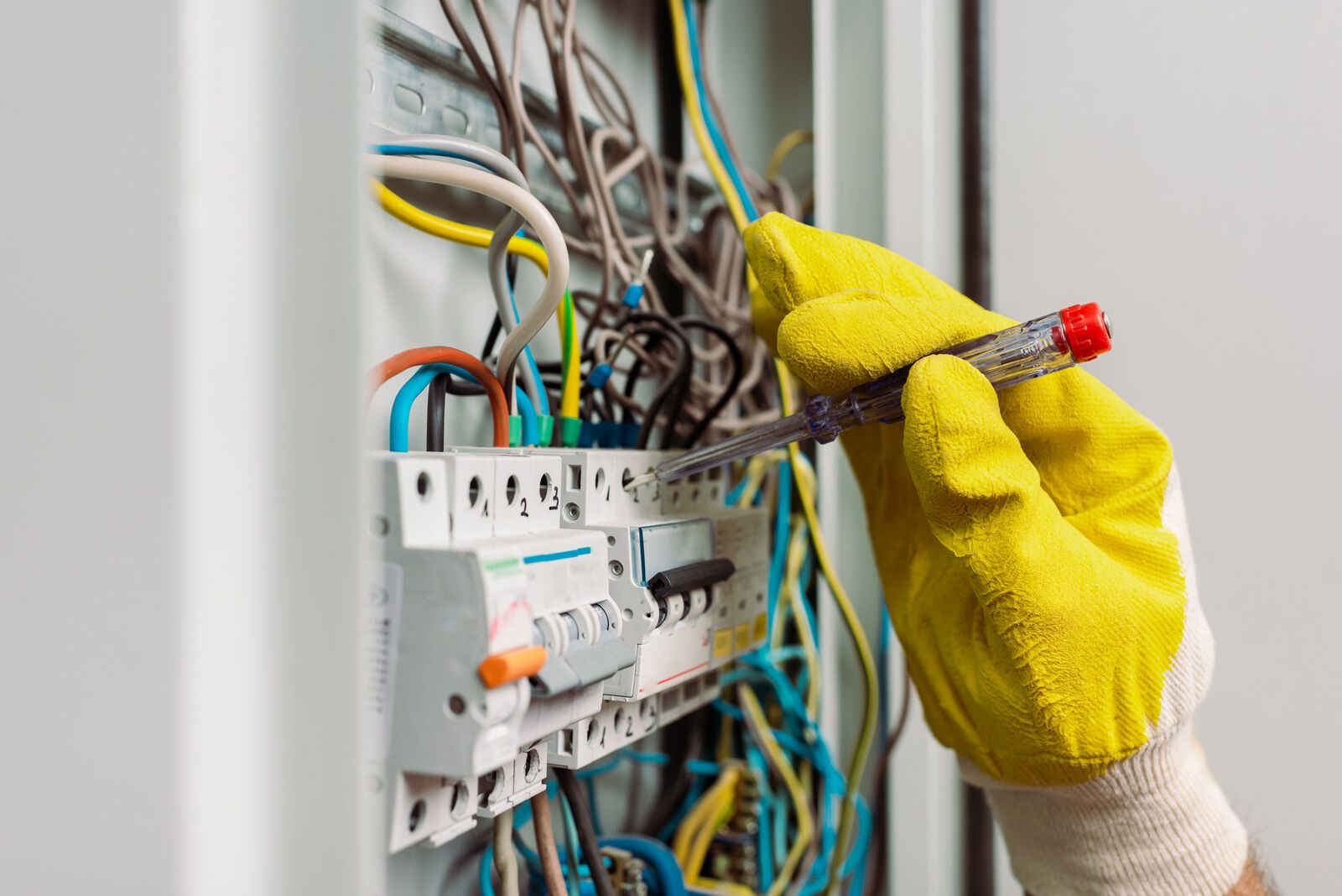New Power Holdings electrician inspecting a distribution board in an older Johannesburg home