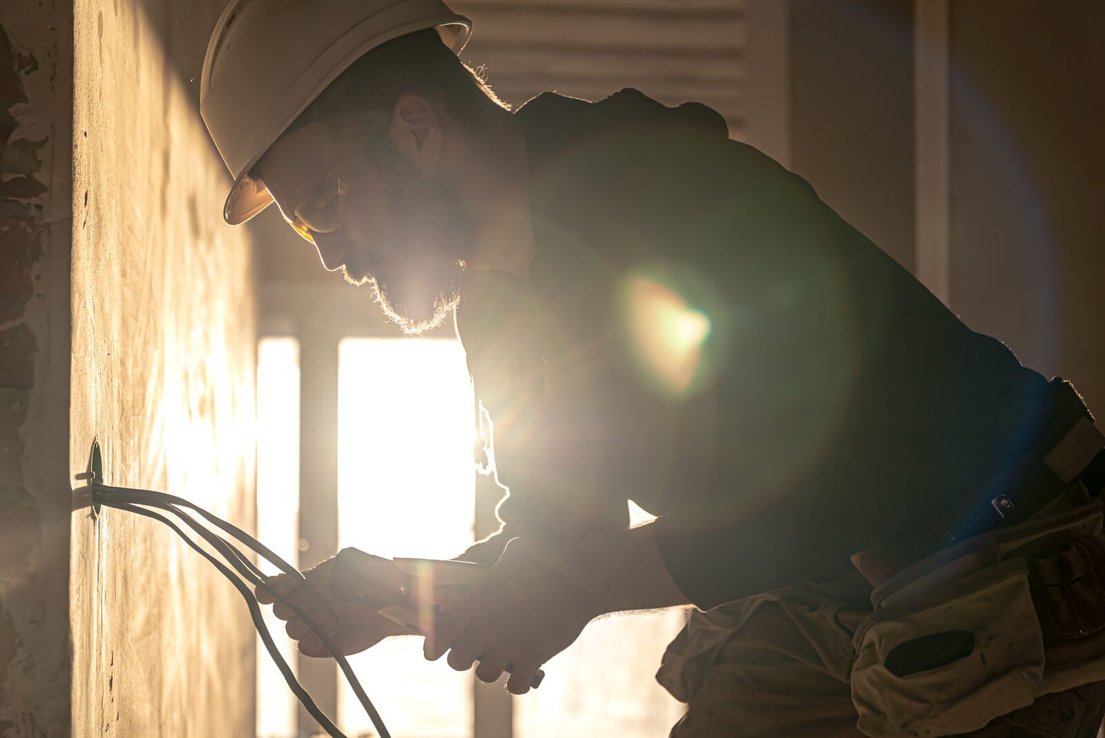 Electrician wiring a distribution board in an Alberton home