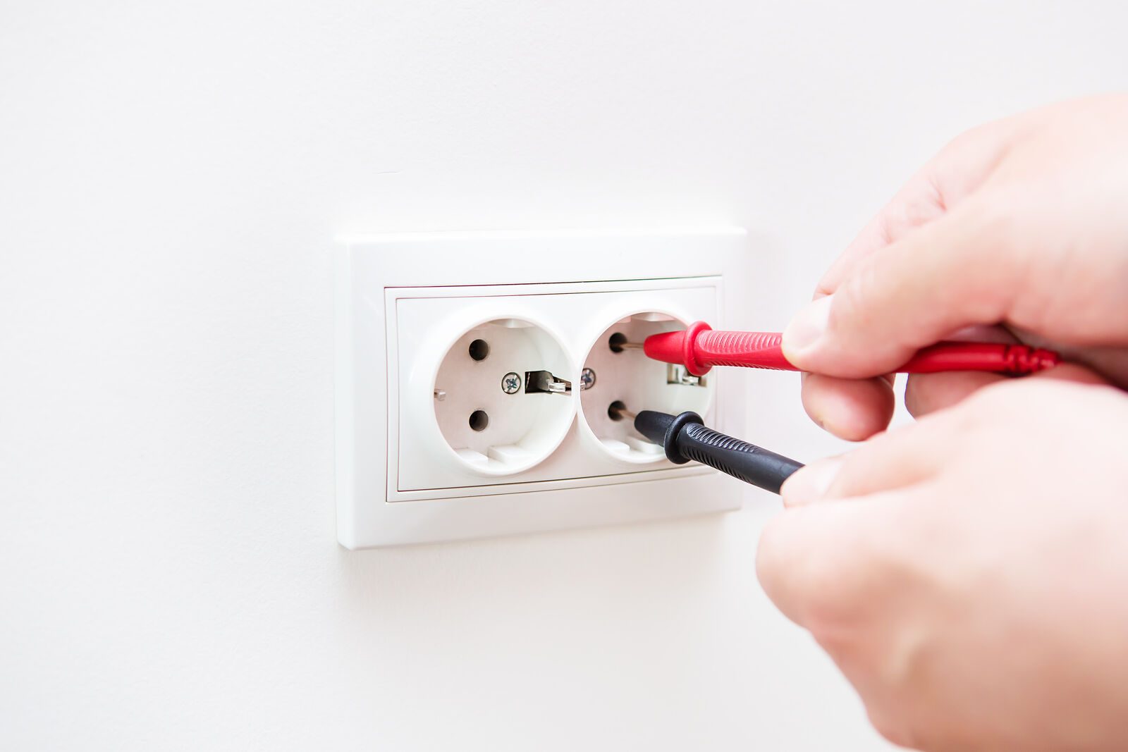 Electrician testing a commercial distribution board in Rivonia